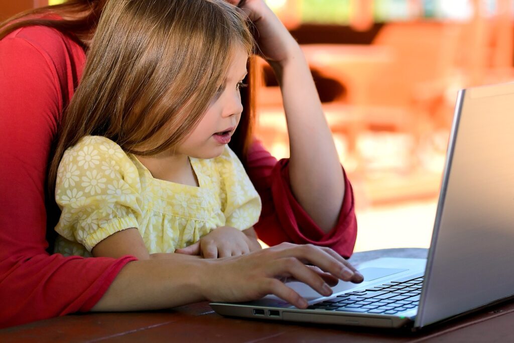 A child participating in speech therapy with a computer.