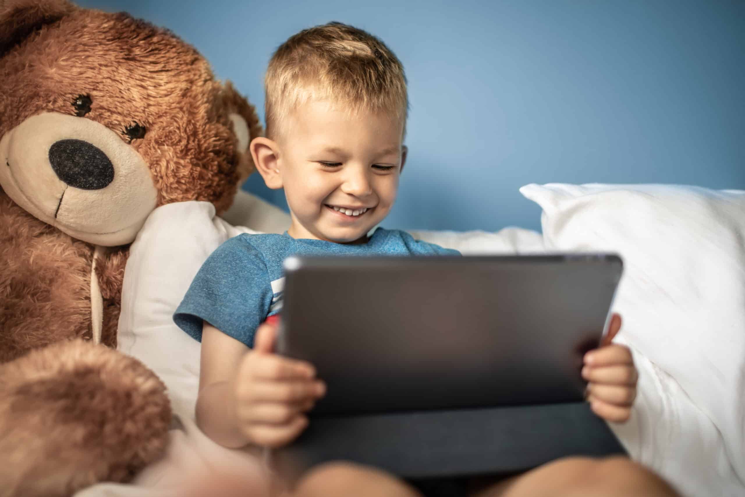 A child participating in articulation therapy at home using an iPAD.