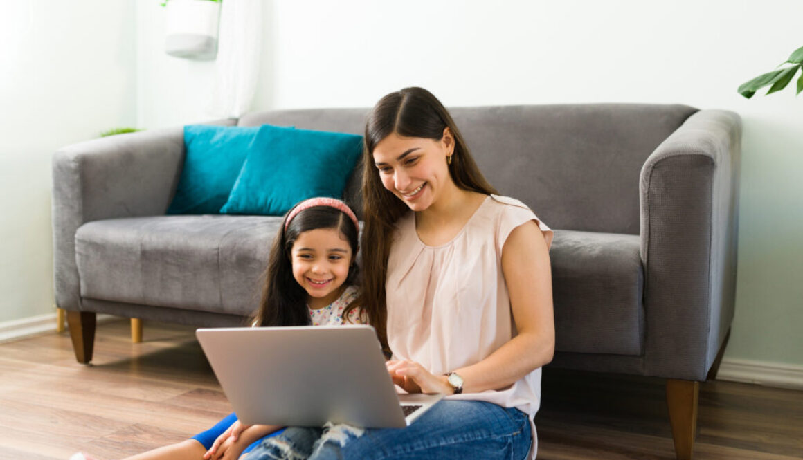 A mother and child participating in online speech therapy.