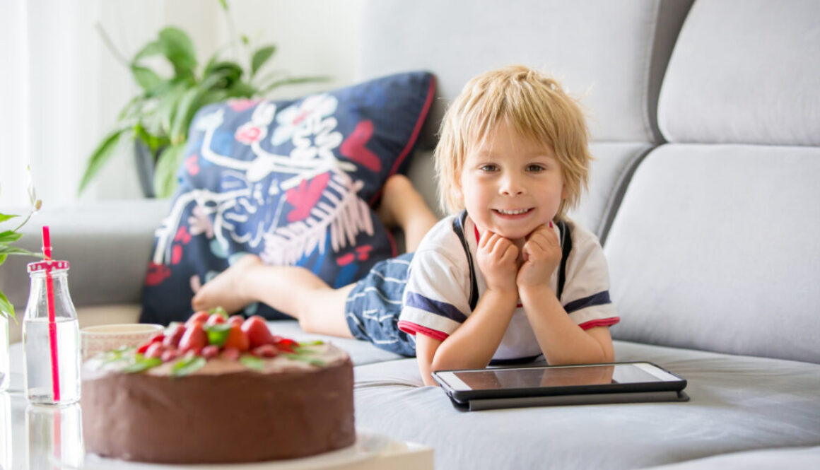 A child getting speech therapy sessions on his iPAD at home.
