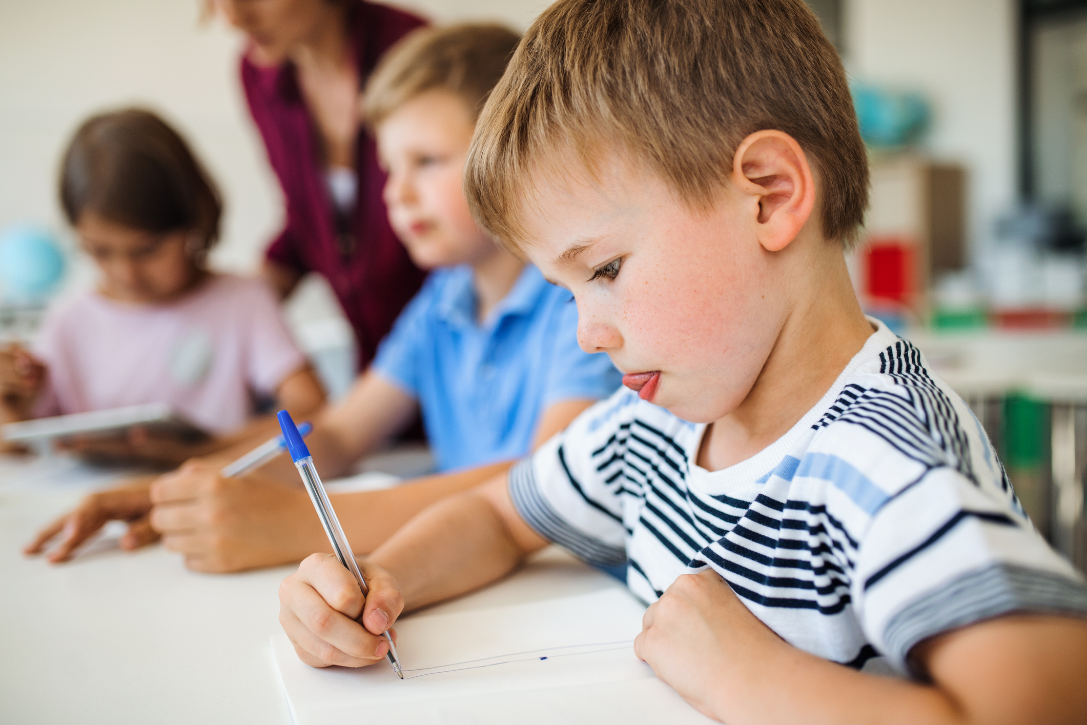 Children learning better language skills in school.
