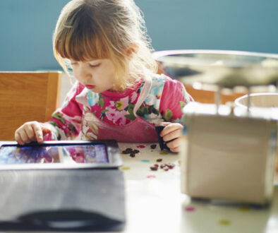 Curious girl using digital tablet