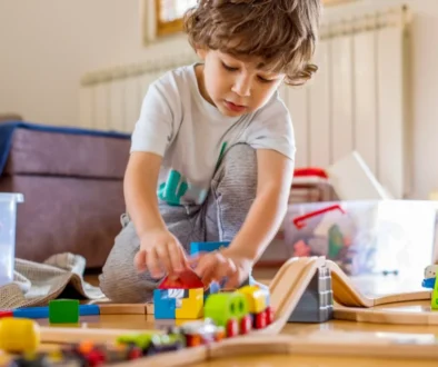 A child participating in play-based speech therapy at home